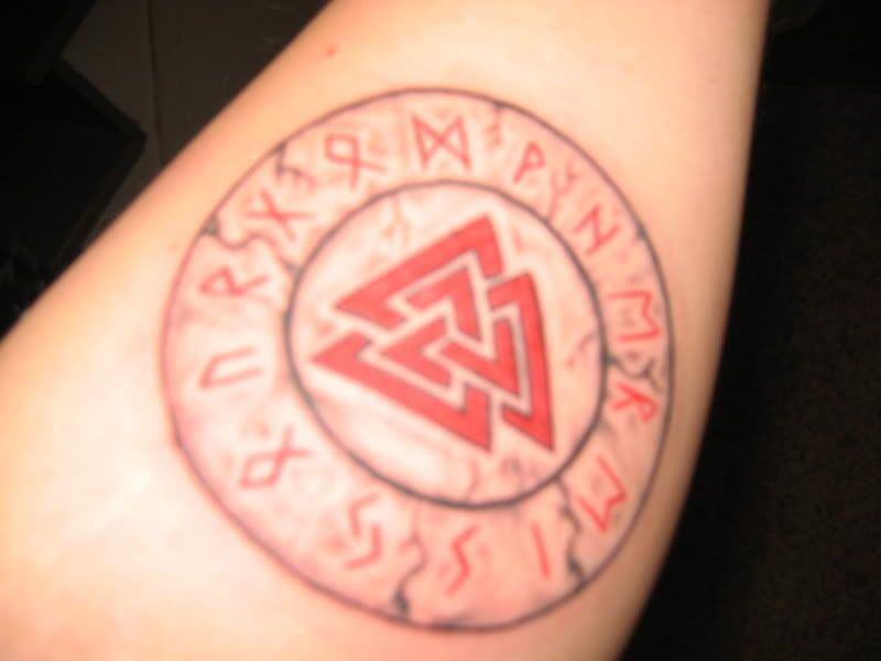 Second tattoo, says WHERE IS YOUR GOD in Norse runes, with a Valnott in the 